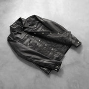 Button &amp; Hem Craftsmanship Construction Detail on Men's Ranchson Noir Leather Shirt pour Homme